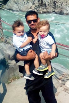 Mr Wangkimshen, pictured with his twin sons, Imran and Ibrahim.
