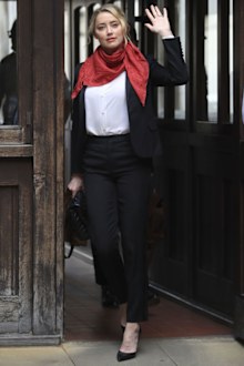 Actress Amber Heard arrives at the High Court for a hearing in Johnny Depp's libel case, in London, Friday, July 24, 2020.