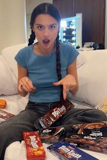 Olivia Rodrigo trying Tim Tams while in Australia for her Guts World Tour. 