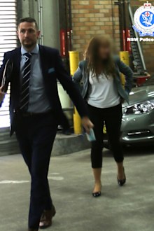 UTS Dean of Science Dianne Jolley is led away by NSW Police after her arrest on campus in November.