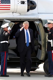US President Donald Trump alights from a helicopter after arriving at Camp Humphreys in Pyeongtaek, south of Seoul.