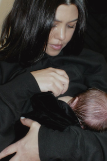 Kourney Kardashian breastfeeds her baby.