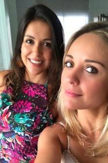 Brazilian fitness influencer Mara Flavia, right, with her sister. Flavia drowned during an Ironman triathlon event on April 18, 2026.