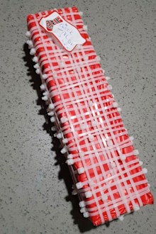 The woman covered the gift for her brother in cable ties