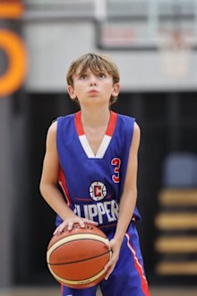 Reggie Bird son playing basketball