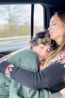Jennifer Lopez cuddles her child Emme.