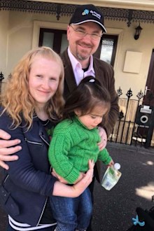 Casey and Aurora with TLC for Kids founder Tim.