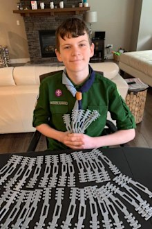 Boy Scout Quinn used his 3D printer to help out healthcare workers.