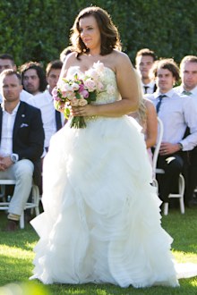 Jess' dress provided by The Sposa Group.