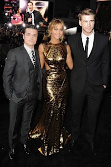 Actors Josh Hutcherson, Jennifer Lawrence, and Liam Hemsworth arrive at the premiere of Lionsgate's "The Hunger Games" at Nokia Theatre L.A. Live on March 12, 2012 in Los Angeles, California.