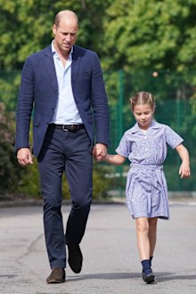 Prince William holds Princess Charlotte's hand 