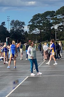 Helen Ryan coaching her Division 5 under 15's netball team for Randwick Rugby Netball Club on their grand final day.