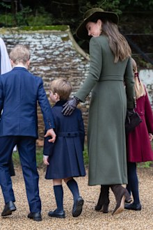 SANDRINGHAM, NORFOLK - DECEMBER 25:  Prince George,  Prince Louis and Catherine, Princess of Wales attend the Christmas Day service at Sandringham Church on December 25, 2022 in Sandringham, Norfolk. King Charles III ascended to the throne on September 8, 2022, with his coronation set for May 6, 2023. (Photo by Samir Hussein/WireImage)