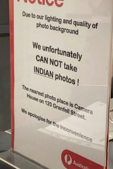 "Due to our lighting and quality of photo background, we unfortunately can not take Indian photos," the sign said.