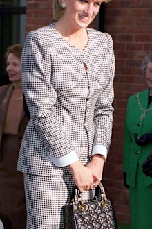 BIRMINGHAM, UNITED KINGDOM - OCTOBER 31 1995:  Princess Diana, Patron, Opening The National Institute Of Conductive Education At Cannon Hill House, Russell Road, Moseley, Birmingham.  The Princess Is Wearing A Black And White Houndstooth Check Suit And She Is Carrying A Christian Dior Black Handbag.  (Photo by Tim Graham Photo Library via Getty Images)