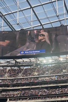 Kim Kardashian seemingly booed by crowd as she attends football game with son Saint.