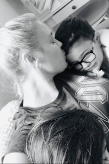 With her two children after three weeks of isolation.