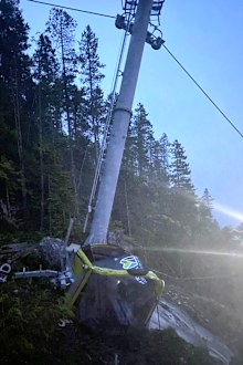 A car from the Sea-to-Sky Gondola lies crumpled on the ground after the cable was cut on Monday (local time).