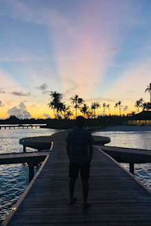 Khaled Mokhatar and Peri Abouzeid  on a pier in the Maldives