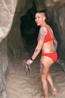 Woman looking in cave in Mexico
