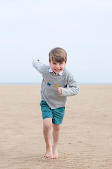 New photos of Prince Louis released on eve of royal's fourth birthday.