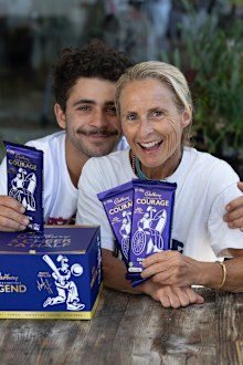 Sam Bloom poses with her son and her Cadbury block.