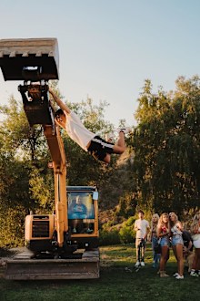 Partygoers were seen 'swinging' from heavy machinery at points during the party.