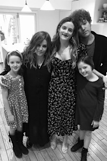 Lisa Marie Presley surrounded by her children.