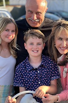 Dr. Phil McGraw and his wife Robin pose with their two eldest grandchildren over Easter.