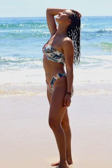 Kirra-Belle Olsson poses in her bikini by the shore.