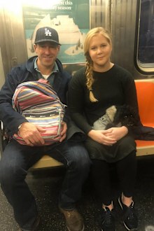 Schumer, 44, announced her split from Chris Fischer, 45, in a casually worded Instagram post, accompanied by a photo of them sitting side-by-side on the train. 