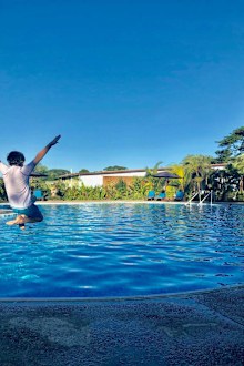 Kid jumping in Fiji resort pool