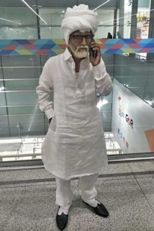 A 32-year-old man was detained at New Delhi's Indira Gandhi International Airport for carrying a fake passport while posing as a man more than 50 years his senior.
