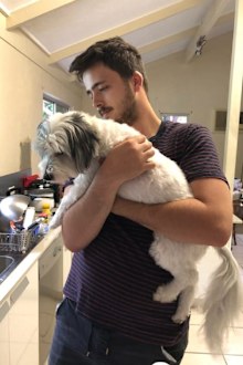 Mother and son epilepsy Lindsay with his dog