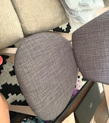 This chair looks assembled but the screws aren't all the way in.