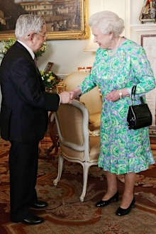 Queen Elizabeth greets Prince Hitachi during a reception for the Praemium Imperiale Awards at Buckingham Palace in central London. 