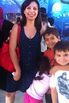 Jo Abi with three children