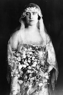 Lady Elizabeth Bowes-Lyon (1900 - 2002) dressed as a bridesmaid to Princess Mary, Countess of Harewood. 