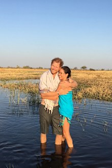 A second photo in the post shows the couple hugging in a lake in Botswana with towels wrapped around them, taken in 2016. 
