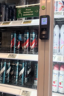 Security cabinet containing deodorant cans at a Woolworths supermarket.