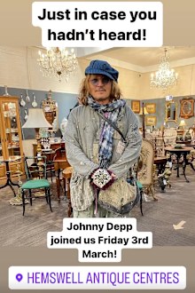 Johnny Depp surprises staff in UK antique store.