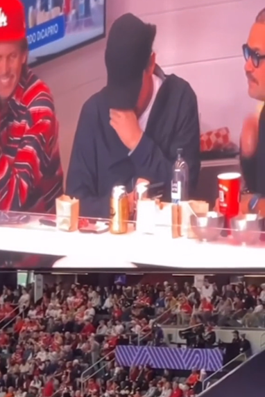 Leonardo DiCaprio hiding from the cameras 