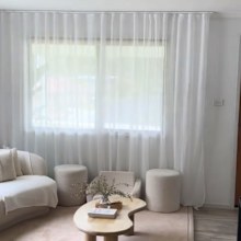 TikToker Mrs Gillick shows how she transformed her living room with Kmart's Sicily S-fold curtains