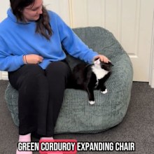 Woman tries Kmart green corduroy expanding chair