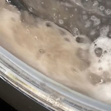 Dirty water in a washing machine during a cleaning cycle