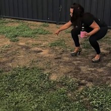Ezza aerates her lawn using high heels