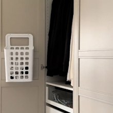 Socks stored in Variera waste bin on back of wardrobe door