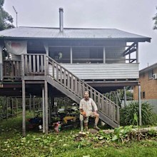 Hamish Webster, pictured outside his home when it was in Lismore.
