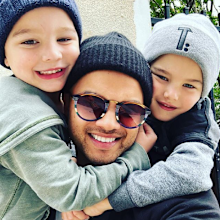 Guy Sebastian boys hugging him.