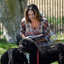 Michelle Obama with her dogs looks on during the annual White House Easter Egg Roll in 2014.